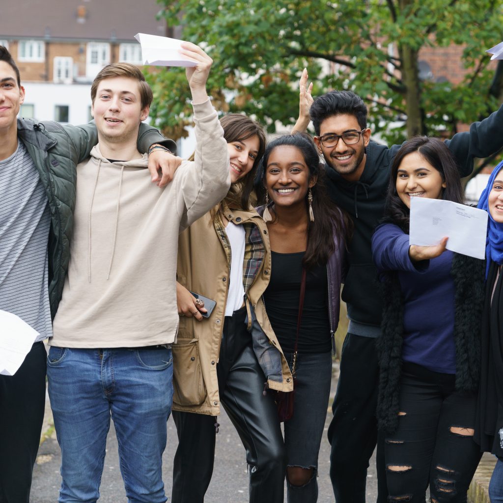 Students all grouped together celebrating their amazing results