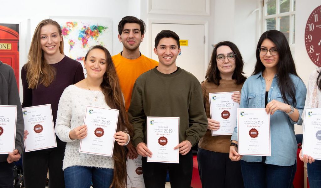 students holding certificates