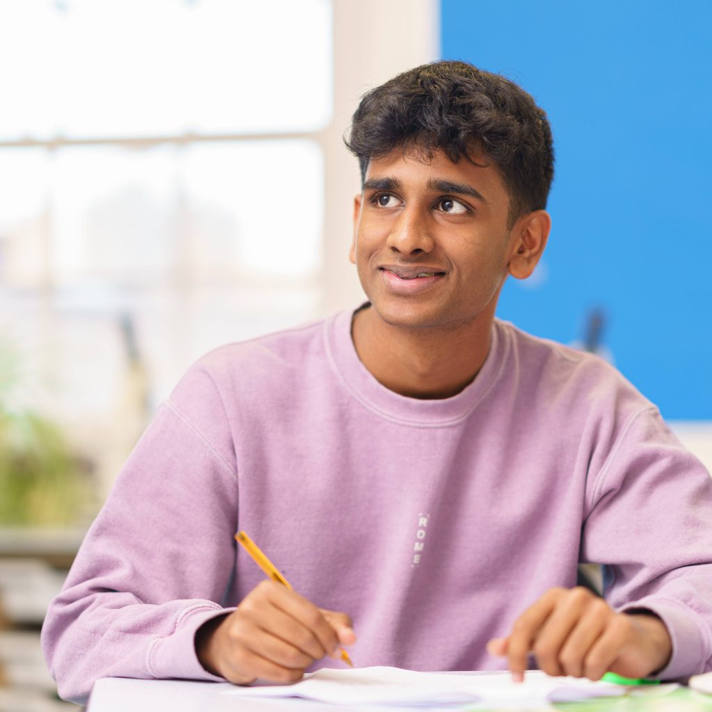 Student holding a pencil
