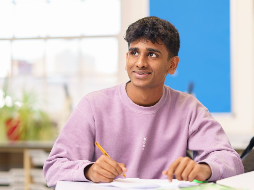 Student holding a pencil