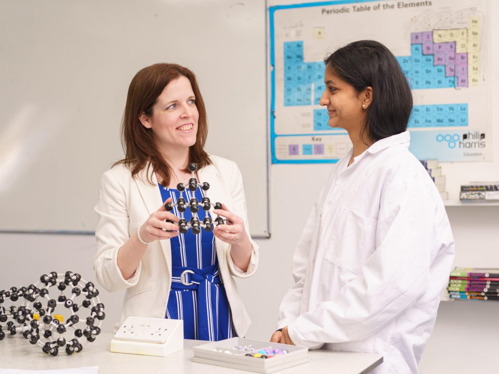 Teacher and her student in the science lab