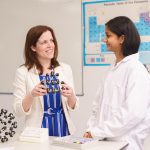 Teacher and her student in the science lab