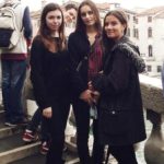 3 students on a walkway in Venice