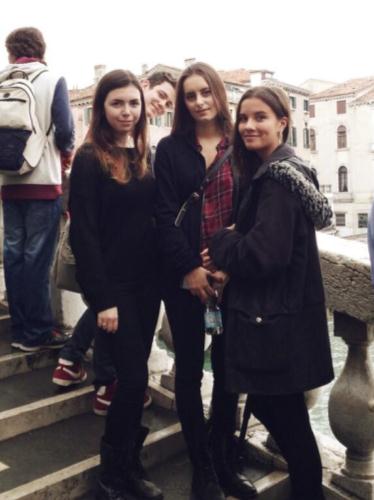 3 students on a walkway in Venice