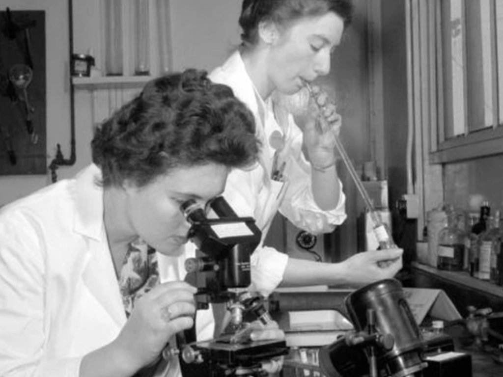 two female scientists doing an experiment