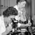 two female scientists doing an experiment