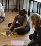 children sat on the floor drawing