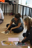 children sat on the floor drawing