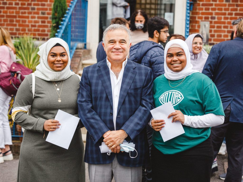 Students smiling as they get their A Level Results