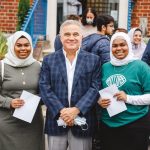 Students smiling as they get their A Level Results