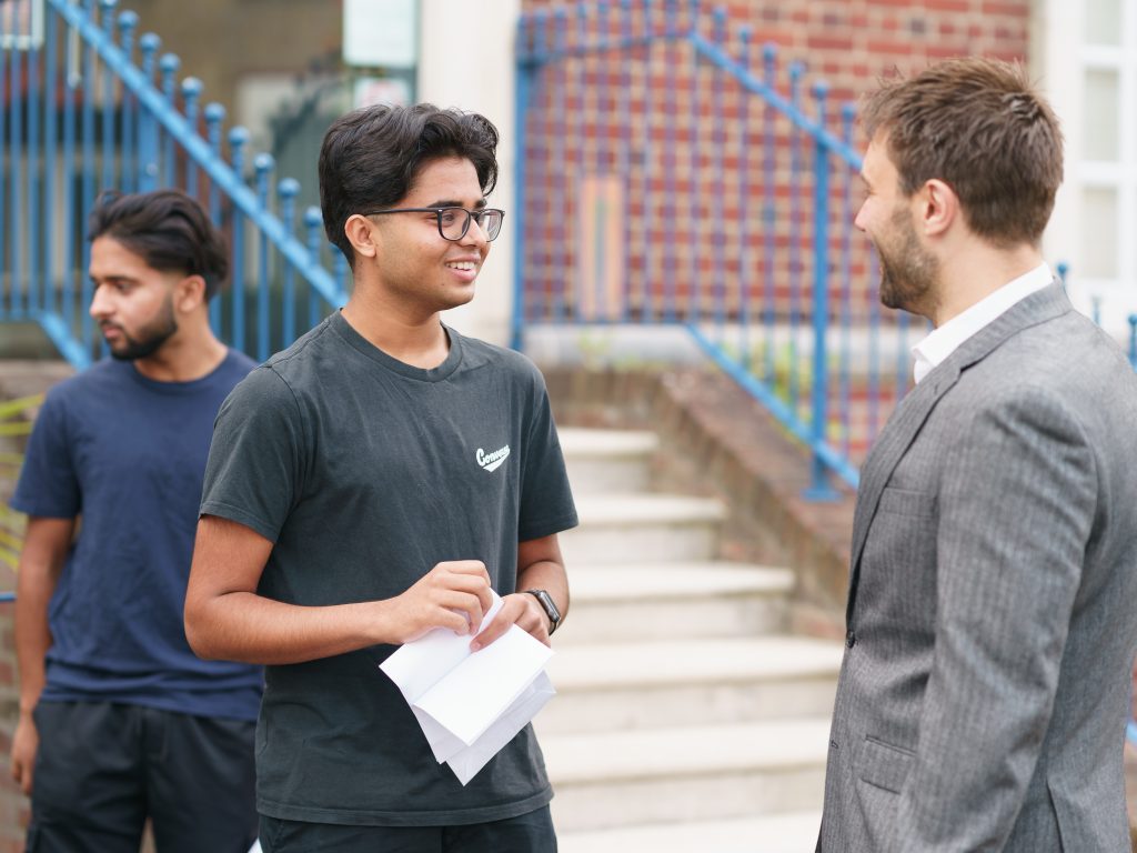 student talking to a teacher