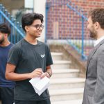 student talking to a teacher