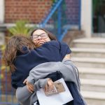 students hugging