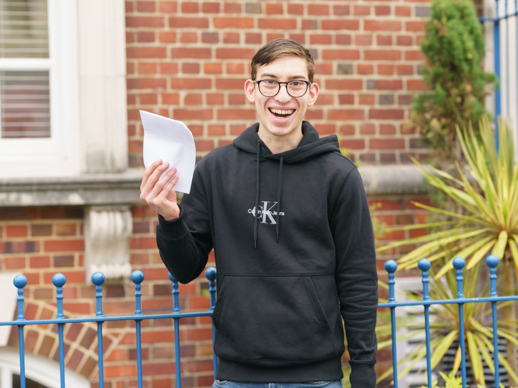 boy happy with his exam results