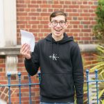 boy happy with his exam results