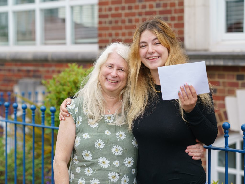 girl and her mum smiling