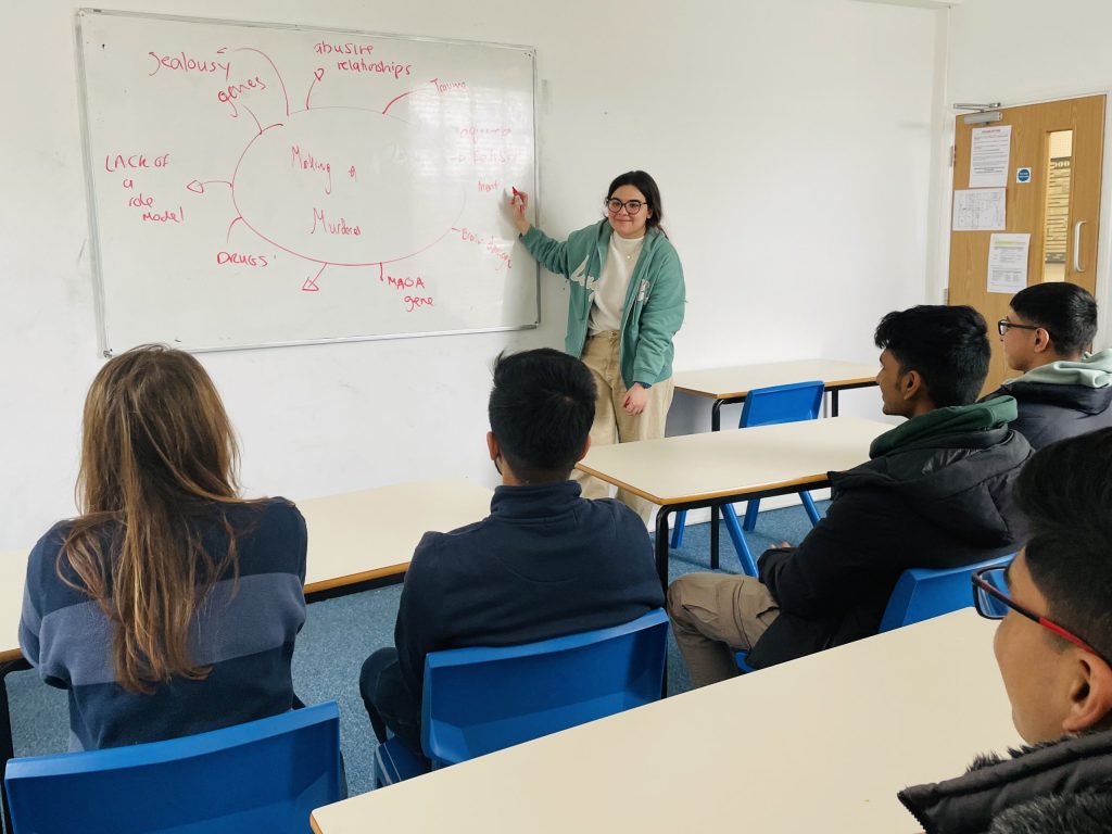 pupil delivering a presentation to her class