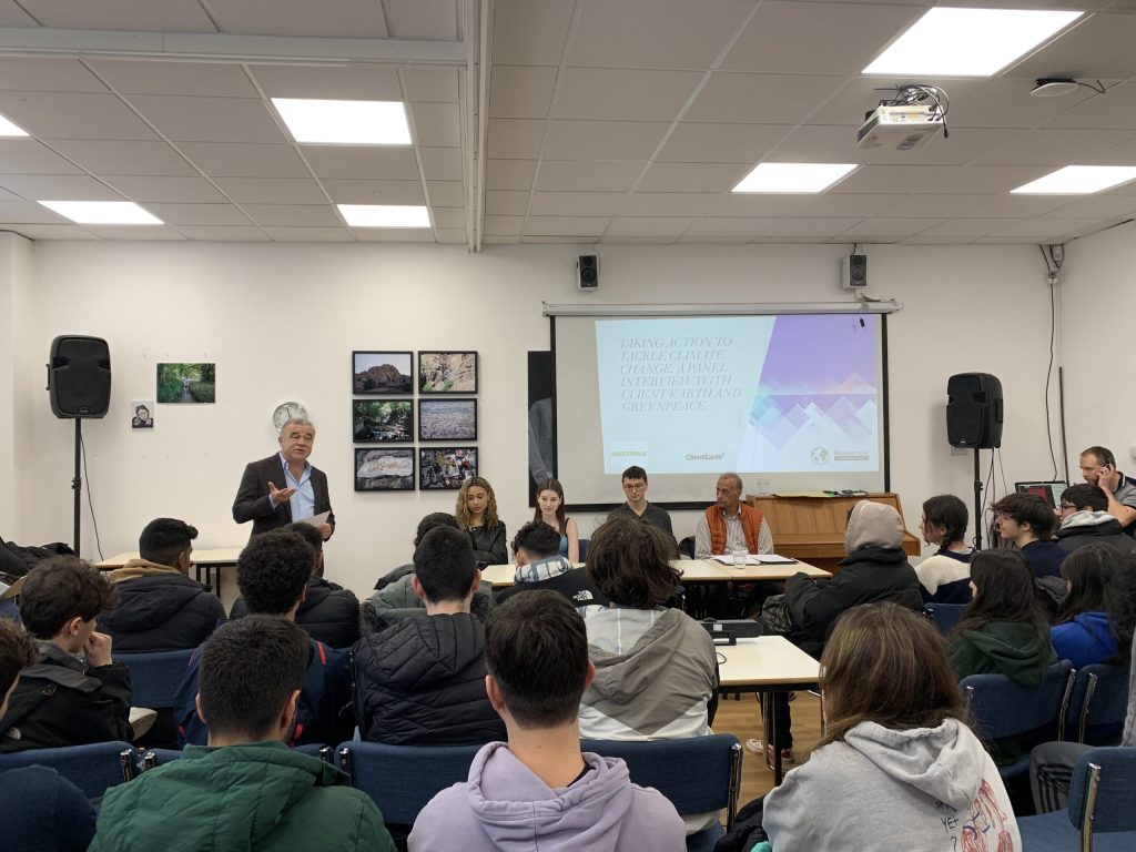 a panel sat in front of pupils