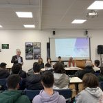 a panel sat in front of pupils