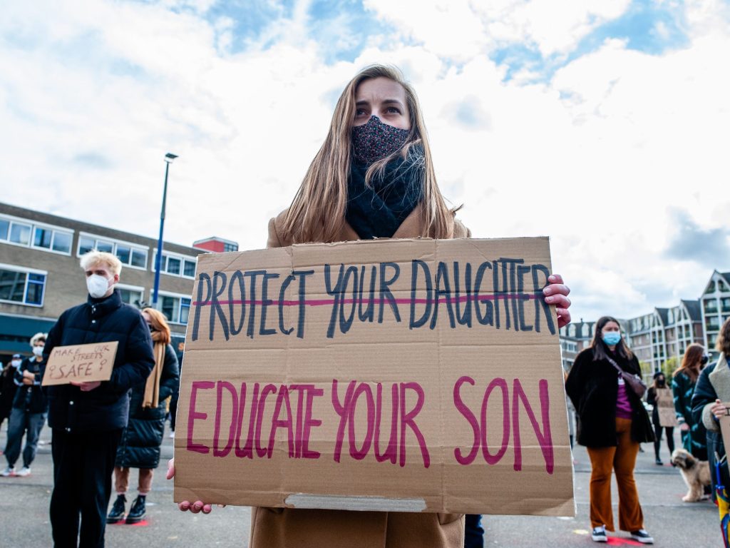 Woman Is Holding A Placard Against Sexual Assault During News Photo 1637853583