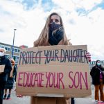 Woman Is Holding A Placard Against Sexual Assault During News Photo 1637853583