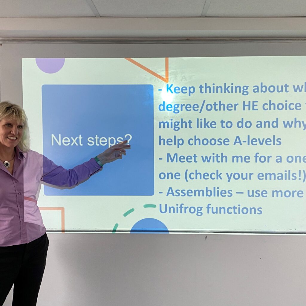lady pointing at a board