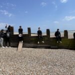 students at the seaside