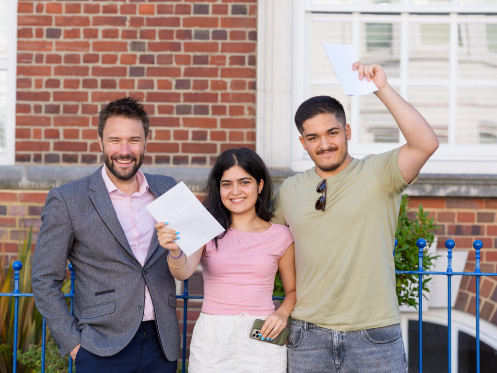 students holding their results