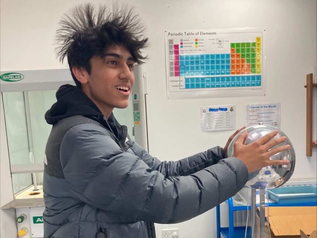 student holding a static ball