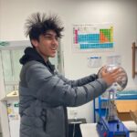 student holding a static ball